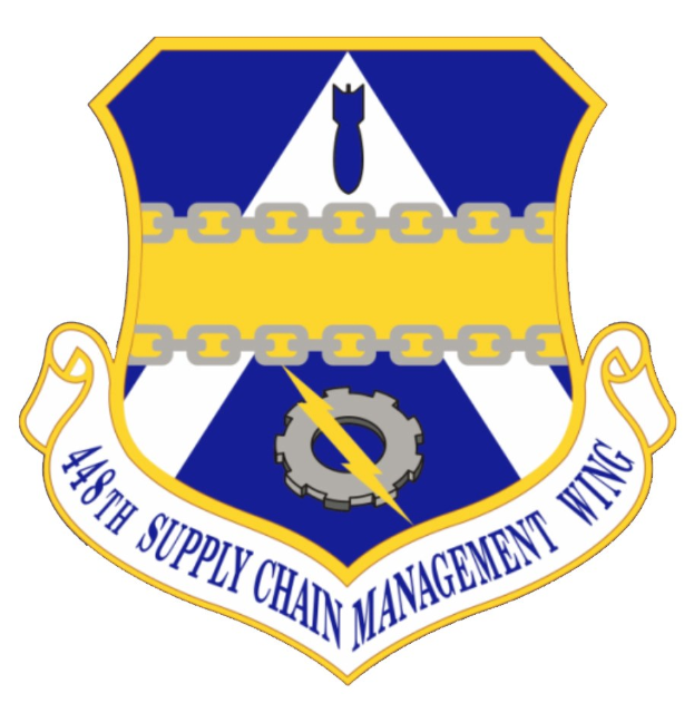 Logo des 48. Versorgungsmanagementgeschwaders mit einem blauen Schild mit einem weißen Stern, einem weißen Banner mit der Aufschrift "Versorgungsmanagement" in blau und dem Text "48. Versorgungsmanagementgeschwader" in fetter schwarzer Schrift.